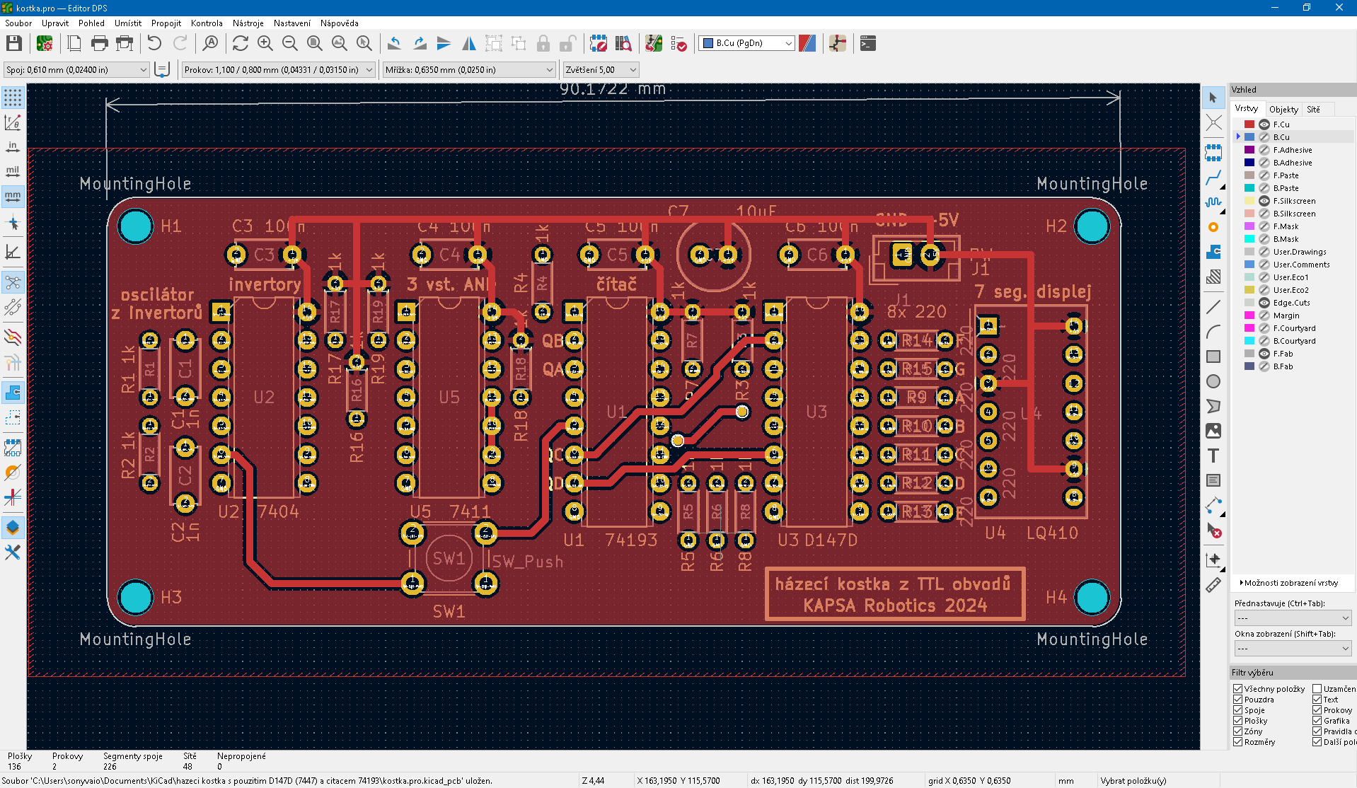 Screenshot designu PCB v programu Kicad zobrazující elektronické komponenty, stopy, montážní otvory a textové popisky.